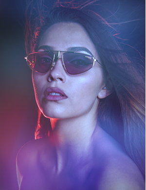 A beautiful brunette woman wearing sunglasses